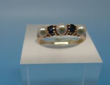 A 14ct gold ring set with sapphires and