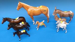 A collection of Beswick horses including