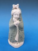 A Continental bisque candle snuffer on b