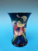A flared Moorcroft vase in the Freesia p