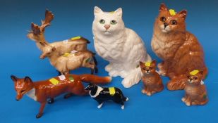 A collection of Beswick cats, large fox,