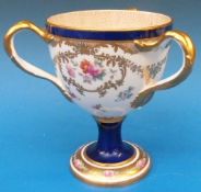 A Cauldon tyg hand decorated with enamel