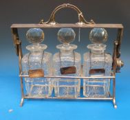 An Art Deco plated three-bottle tantalus