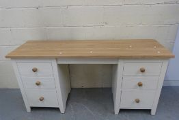 A modern desk with two banks of three dr