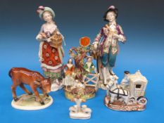 A pair of continental figurines comprisi