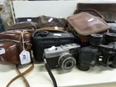 A collection of vintage cameras to inclu