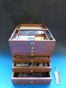 A wooden dentist's chest with graduated