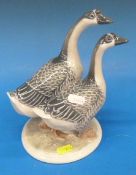 A Royal Copenhagen figure of a pair of g