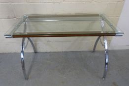 A modern glass and chrome desk / side ta