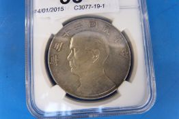 A 1934 Chinese dollar with junk to rever