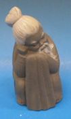A Lladro figure of a seated Oriental gen