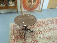 An 18thC/19thC mahogany circular wine ta