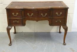 A mahogany leather inset desk (width 113