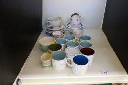 A collection of Susie Cooper cups and sa