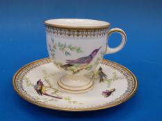 A 19thC hand decorated cup and saucer ve