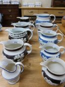 A collection of relief moulded jugs to i