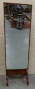 An oak cheval mirror on castors