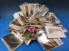 A shoebox full of postcards relating to