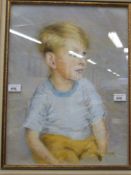 A pastel study of a young boy, signed K