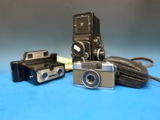 A vintage Rolleiflex TLR camera, a Coron