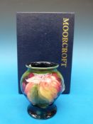 A Moorcroft vase in the Leaf and Berry p