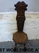 A carved oak spinning chair