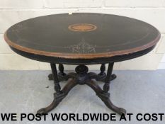 A 19thC ebonised and inlaid oval table (