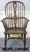 An elm-seated Windsor chair stamped 