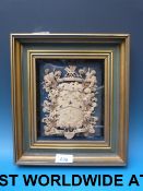 A framed and glazed pressed paper armori