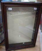 A wall display cabinet with glass openin