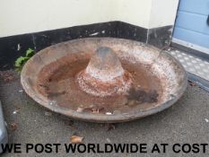 Two cast iron circular pig troughs, 88cm