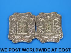 A 19thC Chinese white metal belt buckle