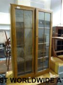 An oak glazed bookcase or display cabine