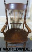 A Victorian oak spindleback armchair.