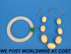 A yellow metal necklace strung with seve