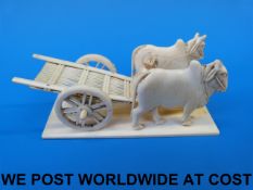 An Indian ivory model of two buffalo pul