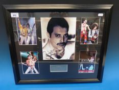 A framed montage of Queen photographs in