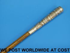 A rhinoceros horn swagger stick with a c