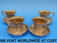 Four Chinese silver cups and saucers wit