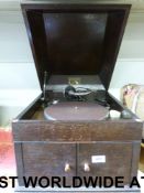 An HMV wind-up gramophone in oak case