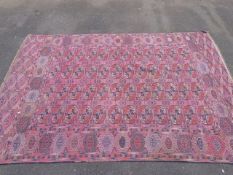 A red ground Pakistan Bokhara carpet wit