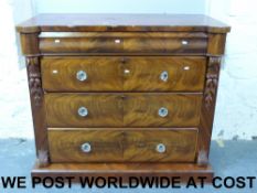 A Victorian flame mahogany chest of draw