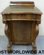 A 19thC walnut davenport having lift up
