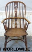 An elm-seated Windsor chair stamped 