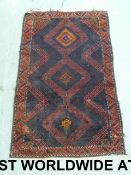 A medium sized navy, orange and red rug