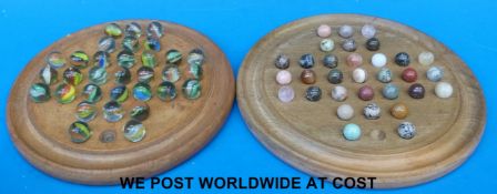 Two solitaire sets with boards, one with