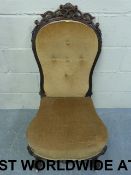 A 19thC carved walnut nursing chair