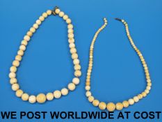 Two ivory necklaces the beads of graduat