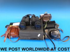 A pair of cased 10 x 50 binoculars and a