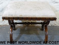 An upholstered Regency rosewood cross fr